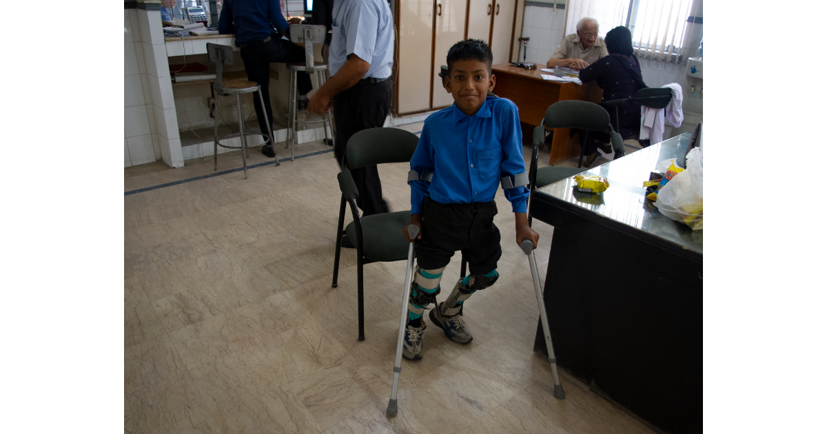 Child with Crutches Smiling